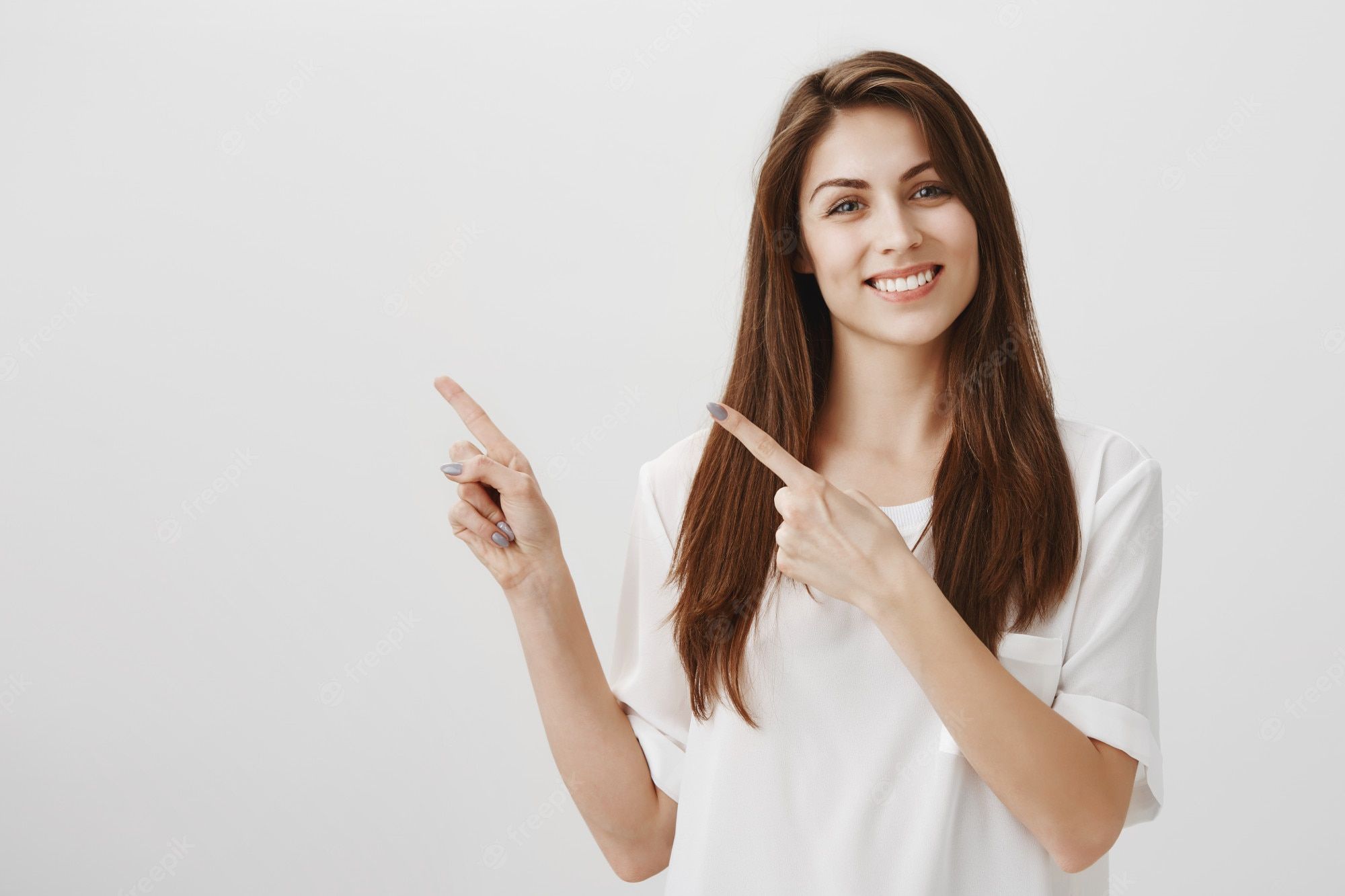 pleased-beautiful-woman-pointing-upper-left-corner-smiling-happy-as-recommend-product_176420-20849